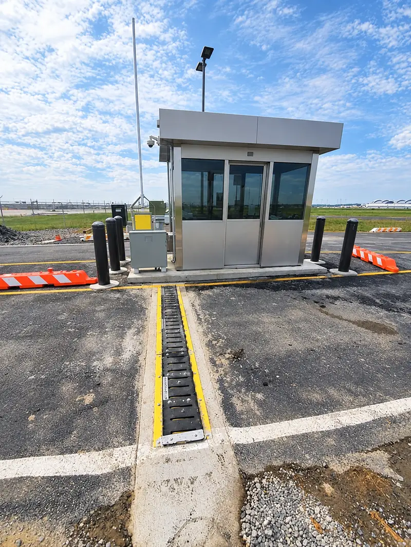 In-ground spikes set in a checkpoint lane leading to a guard booth
