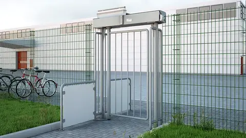 Magnetic MPG full-height swing gate in a perimeter fence beside a bike rack