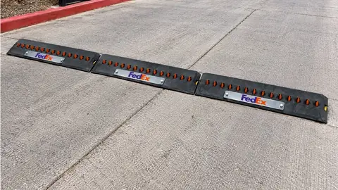 Surface-mounted spike modules with custom FedEx logo faceplates