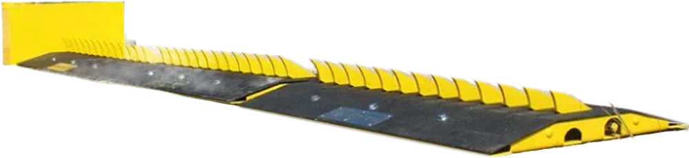 Motorized surface-mounted spike unit with yellow teeth and end housing