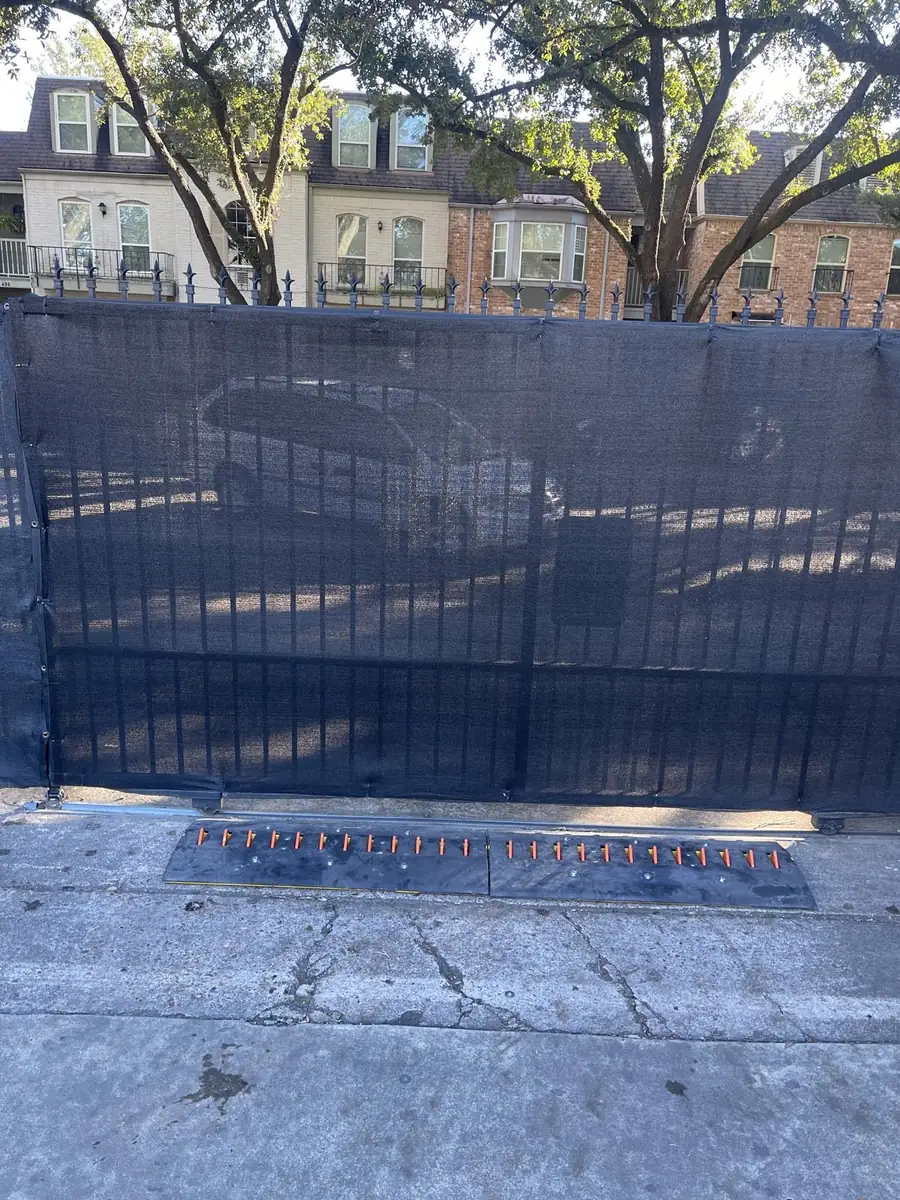 Spike system installed at an apartment complex exit gate