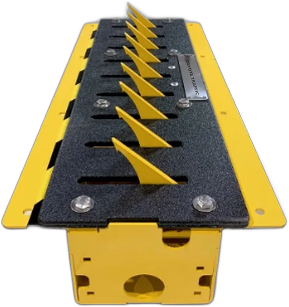 Coyote Traffic in-ground spike unit with yellow teeth and flush steel frame