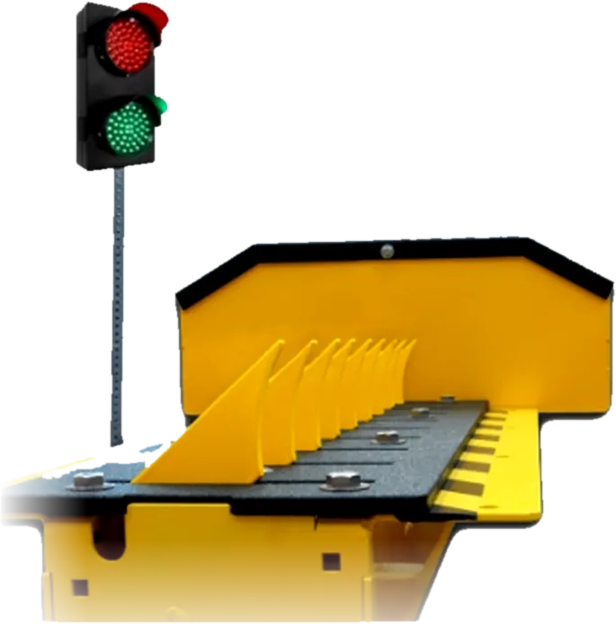 Coyote Traffic in-ground motorized spike unit with yellow teeth and red-green signal light