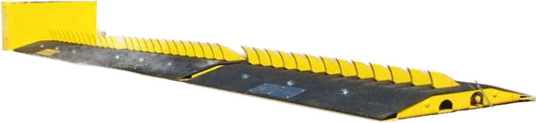 Coyote Traffic motorized surface-mounted spike system with yellow teeth and drive housing