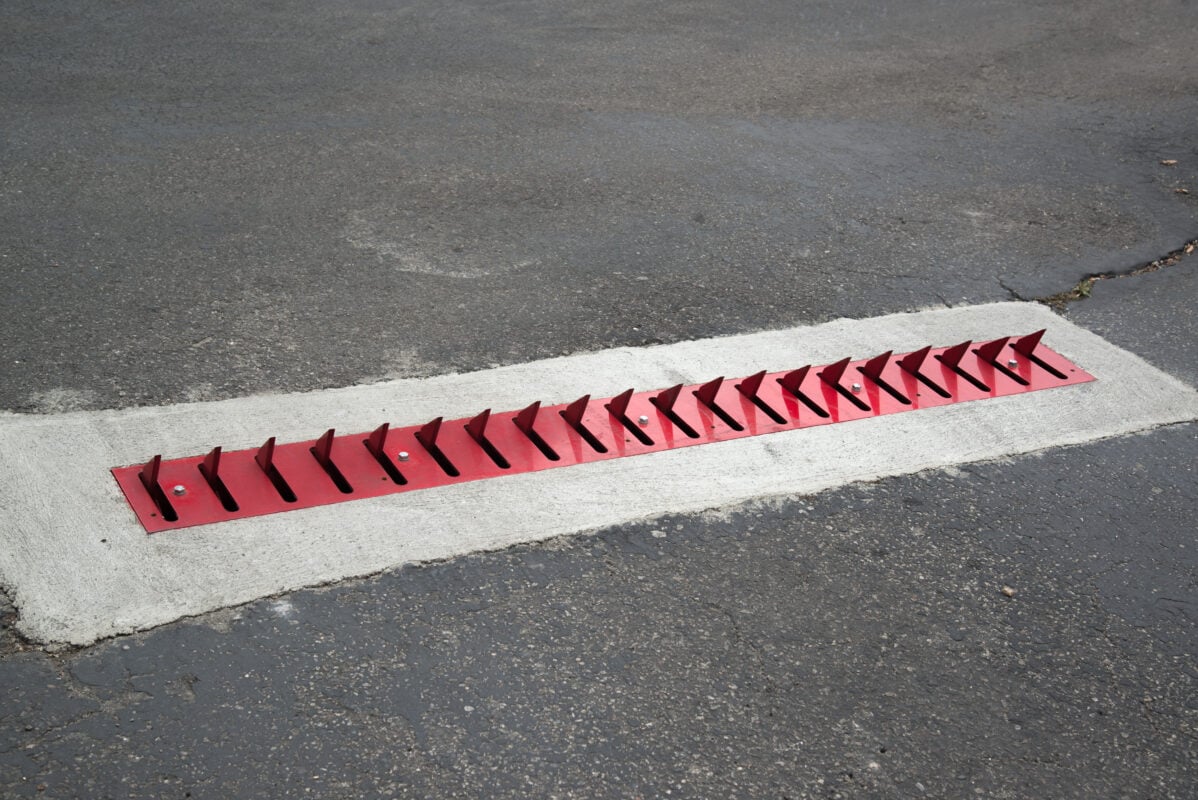 Sleek flush-mounted traffic spikes installed at a high-end facility.